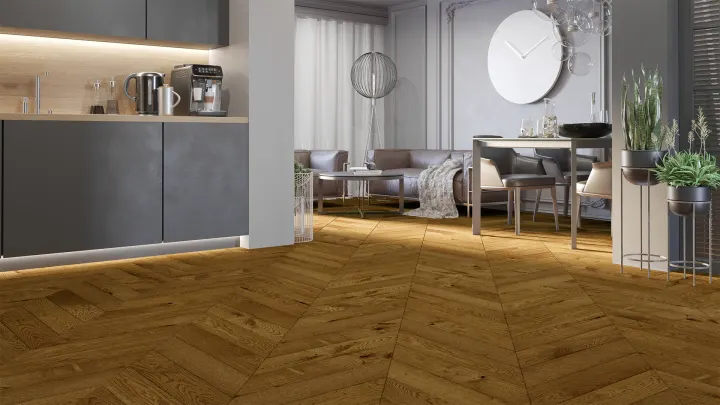 Obývací prostor s kuchyňskou linkou a podlahou Barlinek Dub Honey ve vzoru francouzského stromečku
